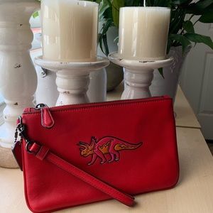 Coach Dinosaur wristlet